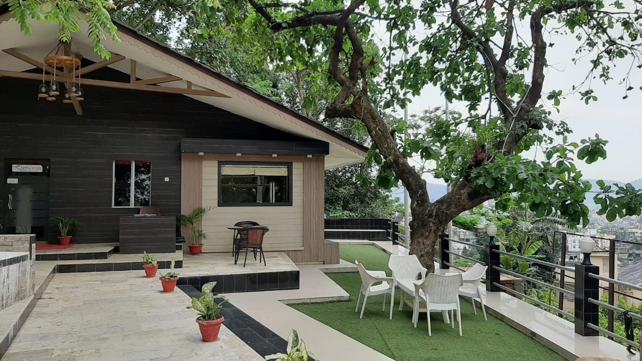 Pavilion terrace looking out over Guwahati through old trees